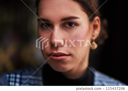 Woman, portrait and beauty in city, makeup and serious for skincare or outdoor cosmetics. Female person, town and relax on vacation for weekend, holiday and travel for aesthetic, proud and relax 115437206