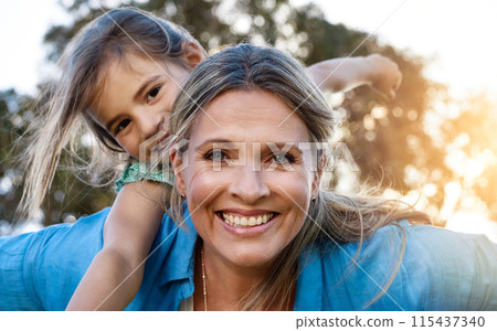 Happy, portrait or mother and daughter with piggyback, love or hug in park for fun, adventure or journey outdoor at sunset. Family, face and mom carrying girl in a forest with support, trust or games 115437340