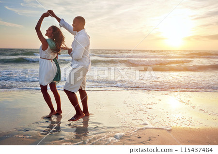 Couple, celebrate and dance on beach with outdoor romance, holiday and vacation by ocean or sunset space. Happy people spinning and holding hands with love and travel on anniversary or valentines day Couple, celebrate and dance on beach with outdoor romance, holiday and vacation by ocean or sunset space. Happy people spinning and holding hands with love and travel on anniversary or valentines day 115437484