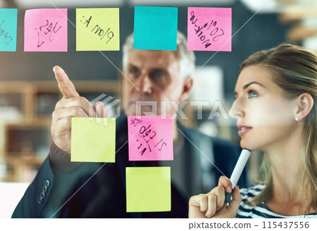 Thinking, brainstorming and business people with hand pointing in office for project, management or teamwork solution. Agenda, calendar and girl with mature mentor for training, learning or coaching 115437556