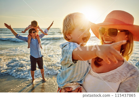 Happy family, mother and beach with little boy for bonding, outdoor holiday or weekend in nature sunset. Mom, father or children with smile for embrace, love or care in sunshine by ocean coast or sea Happy family, mother and beach with little boy for bonding, outdoor holiday or weekend in nature sunset. Mom, father or children with smile for embrace, love or care in sunshine by ocean coast or sea 115437865