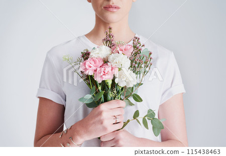 Woman, plant and blossom with flower bouquet for gift, valentines day or anniversary on a white studio background. Female person or model with natural leaves, stem or bloom for romance, love or care Woman, plant and blossom with flower bouquet for gift, valentines day or anniversary on a white studio background. Female person or model with natural leaves, stem or bloom for romance, love or care 115438463