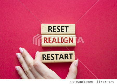 Reset Realign Restart symbol. Concept words Reset Realign Restart on wooden blocks. Businessman hand. Beautiful red background. Business and Reset Realign Restart concept. Copy space. Reset Realign Restart symbol. Concept words Reset Realign Restart on wooden blocks. Businessman hand. Beautiful red background. Business and Reset Realign Restart concept. Copy space. 115438529