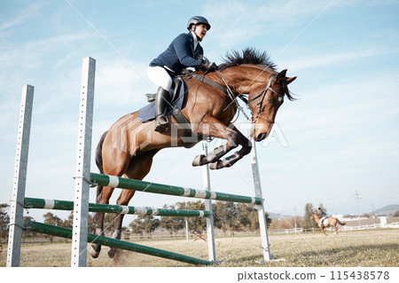 Show jumping, woman and horse on ranch or farm for fitness, training and event or competition. Sport, animal and movement in countryside for course, dressage and performance in arena in Texas 115438578
