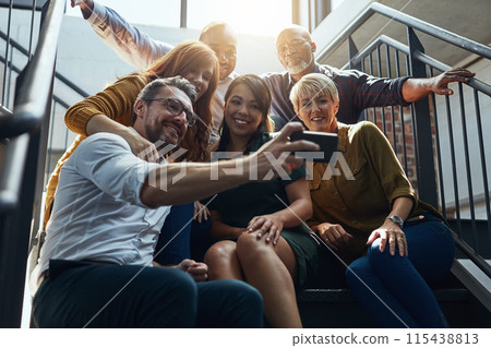 Group, people and stairs with smile or phone, diversity in office with low light. Crowd, international or happiness with mobile technology for company profile picture, team building for employees Group, people and stairs with smile or phone, diversity in office with low light. Crowd, international or happiness with mobile technology for company profile picture, team building for employees 115438813