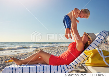 Woman, lifting and boy on beach in playing on holiday, vacation in Istanbul for happiness or memory. Excited, mom and child for relax, together and bonding in play for growth, development or love 115438922