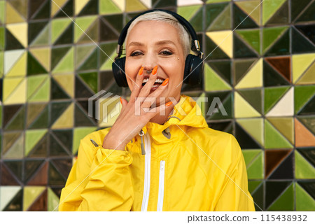 Headphones, portrait and happy woman for podcast in the city, audio for streaming and wall background. Laughing, excited and female from Brazil listening to track, girl smile and funny radio show Headphones, portrait and happy woman for podcast in the city, audio for streaming and wall background. Laughing, excited and female from Brazil listening to track, girl smile and funny radio show 115438932