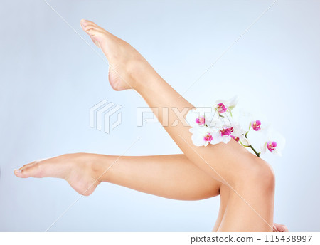 Beauty, flower and legs of woman in studio for wellness, cosmetics and glow treatment on white background. Mockup, orchid and skincare by model with eco friendly hair removal, waxing or vegan product Beauty, flower and legs of woman in studio for wellness, cosmetics and glow treatment on white background. Mockup, orchid and skincare by model with eco friendly hair removal, waxing or vegan product 115438997