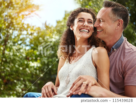 Smile, couple and hug with laughter at silly joke for marriage humor with comedy and happiness on honeymoon. Excited, husband and wife with love embrace for connection, support or bonding in nature Smile, couple and hug with laughter at silly joke for marriage humor with comedy and happiness on honeymoon. Excited, husband and wife with love embrace for connection, support or bonding in nature 115439028