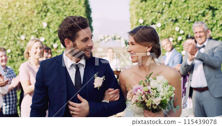 Wedding, couple and love at celebration with smile, friends and family at venue. Bride, groom and happiness at marriage for commitment, bouquet and audience with applause and excited for union 115439078