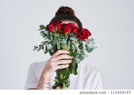 Woman, hands and red roses with bouquet of flowers for floral, anniversary or gift on a white studio background. Female person or model with natural plant, leaves or stem for romance, present or love Woman, hands and red roses with bouquet of flowers for floral, anniversary or gift on a white studio background. Female person or model with natural plant, leaves or stem for romance, present or love 115439147