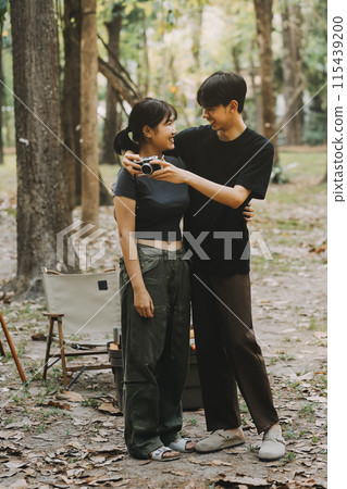 Asian couple sweet in tent inside on they camping trip, traveller relax and sleep togather in out door and camping trip 115439200
