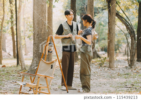Asian couple sweet in tent inside on they camping trip, traveller relax and sleep togather in out door and camping trip 115439213