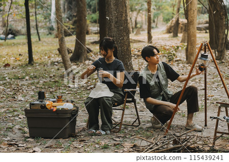 Asian couple sweet in tent inside on they camping trip, traveller relax and sleep togather in out door and camping trip 115439241