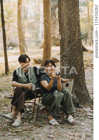 Asian couple sweet in tent inside on they camping trip, traveller relax and sleep togather in out door and camping trip Asian couple sweet in tent inside on they camping trip, traveller relax and sleep togather in out door and camping trip 115439262