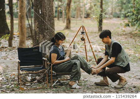Asian couple sweet in tent inside on they camping trip, traveller relax and sleep togather in out door and camping trip Asian couple sweet in tent inside on they camping trip, traveller relax and sleep togather in out door and camping trip 115439264