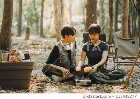 Asian couple sweet in tent inside on they camping trip, traveller relax and sleep togather in out door and camping trip Asian couple sweet in tent inside on they camping trip, traveller relax and sleep togather in out door and camping trip 115439277