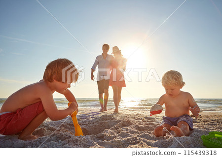 Travel, family and children with sand castle on beach for holiday, summer or vacation together. Mother, father and brother siblings outdoor on tropical coast for adventure, bonding or development Travel, family and children with sand castle on beach for holiday, summer or vacation together. Mother, father and brother siblings outdoor on tropical coast for adventure, bonding or development 115439318