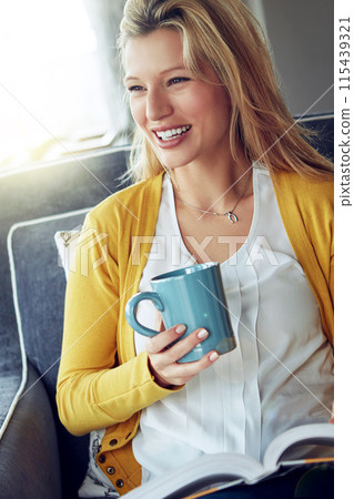 Woman, armchair and coffee break with happiness, relax or smile as interior designer for architecture firm. Female person, cheerful and rest in home for calm, stress management or peace as consultant 115439321
