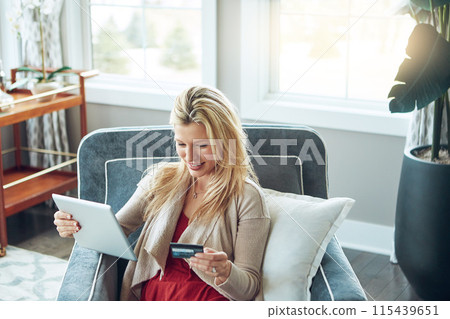 Woman, banking card and tablet in living room, fintech and online transaction for shopping in house. Customer, internet payment and sale or credit app, ecommerce and relax for happy purchase 115439651