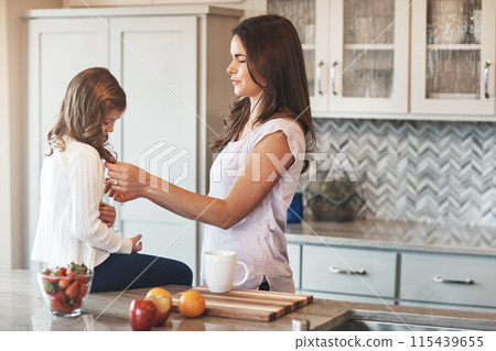 Counter, mother and love for daughter, kitchen or bonding in weekend, house and kid with smile for parent. Home, child and mom with girl, care and together in morning, peace or happiness in apartment 115439655