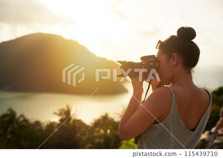 Sunset, photography and woman in nature shooting with camera, tech or memory of travel on island. Creative, photographer and cinematic recording of sea, ocean or environment with content creator Sunset, photography and woman in nature shooting with camera, tech or memory of travel on island. Creative, photographer and cinematic recording of sea, ocean or environment with content creator 115439710