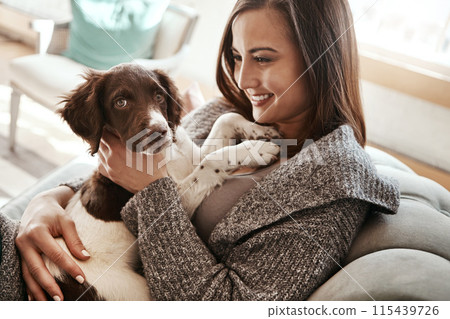 Love, relaxing and woman with dog on sofa bonding with pet in living room at apartment. Smile, animal and happy female person cuddle, hug and embrace puppy with care on couch in lounge at home. 115439726