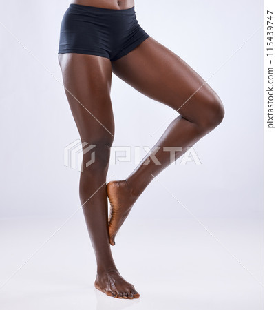 Underwear, black woman and legs in studio for cellulite, treatment and skincare with pride for wellness. Body, glow and female person for hair removal by white background with results for luxury Underwear, black woman and legs in studio for cellulite, treatment and skincare with pride for wellness. Body, glow and female person for hair removal by white background with results for luxury 115439747