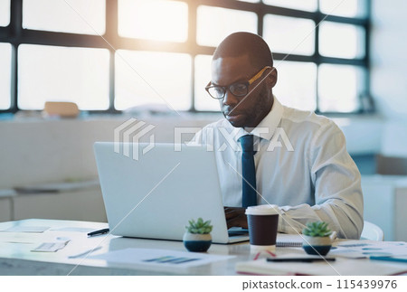 Finance, documents or businessman with laptop in office for planning, research or tax, savings or review. Fintech, investment or African accountant with glasses for startup, accounting or sale profit 115439976