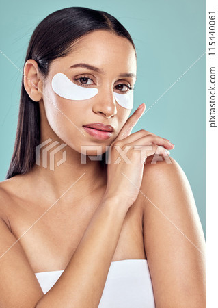 Woman, hands and eye patch for beauty and skincare, hydration and refresh on blue background. Mock up, dermatology and facial treatment for collagen, portrait and detox for female person in studio Woman, hands and eye patch for beauty and skincare, hydration and refresh on blue background. Mock up, dermatology and facial treatment for collagen, portrait and detox for female person in studio 115440061