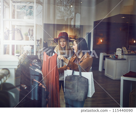 Smile, customer and women with dress in boutique shop for promotion, sale and discount. Happy, female friends and people checking rack of clothes in fabric, fashion and retail store at indoor mall Smile, customer and women with dress in boutique shop for promotion, sale and discount. Happy, female friends and people checking rack of clothes in fabric, fashion and retail store at indoor mall 115440090