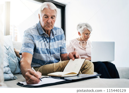 Senior couple, laptop and serious with writing on document in sofa for retirement or shopping list for household. People, planning and budgeting at home for savings, insurance and asset management Senior couple, laptop and serious with writing on document in sofa for retirement or shopping list for household. People, planning and budgeting at home for savings, insurance and asset management 115440129