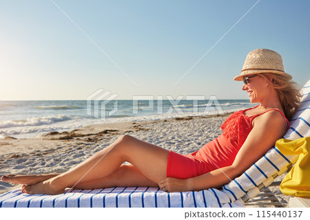 Travel, woman and relax on chair at beach for tropical island, vacation or outdoor adventure. Happy, female person and smile with thinking by ocean for summer tourism, holiday or weekend trip in Bali 115440137