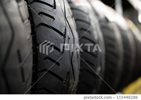 A row of motorcycle tires 115440286