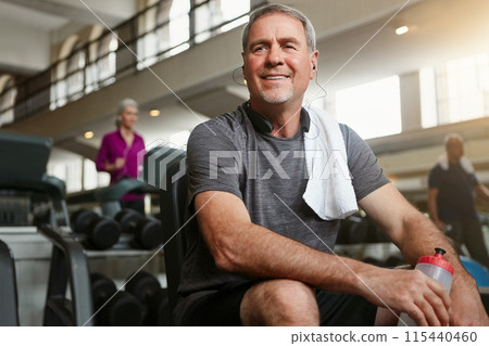 Fitness, thinking and senior man in gym with water bottle for training, exercise and workout. Sports, retirement and person with liquid, minerals and listening music for wellness, health and active Fitness, thinking and senior man in gym with water bottle for training, exercise and workout. Sports, retirement and person with liquid, minerals and listening music for wellness, health and active 115440460