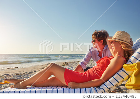Couple, smile and relax with chair at beach for holiday, travel and romantic honeymoon together. Man, woman and happy with thinking by ocean for summer vacation, love or outdoor adventure in Maldives Couple, smile and relax with chair at beach for holiday, travel and romantic honeymoon together. Man, woman and happy with thinking by ocean for summer vacation, love or outdoor adventure in Maldives 115440485