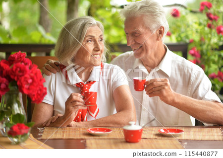 Portrait of senior couple drinking coffee at home Portrait of senior couple drinking coffee at home 115440877