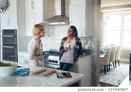 Coffee, morning and relax with friends in kitchen of home together for bonding or breakfast. Conversation, smile and women with happy roommate people drinking tea in apartment for break or chatting 115440907