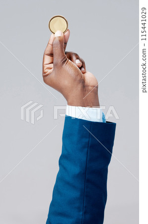 Investment, hand and gold coin in studio grey background for crypto currency, financial security and ecommerce. Business person, money or cash token for safe banking, payment or blockchain exchange 115441029