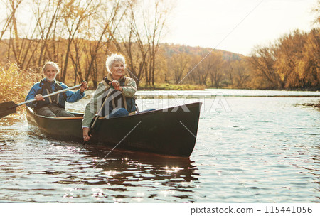 Lake, senior couple and rowing in nature with canoe for explore, adventure or retirement activity. Outdoor, river and elderly woman with man on boat for kayaking, holiday or weekend break in Sydney 115441056