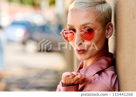 Girl, portrait and blowing kiss in outdoor, love and flirting fashion in city for shades or style. Female person, sunglasses and emoji for romance on street, care and cool eyewear on downtown date Girl, portrait and blowing kiss in outdoor, love and flirting fashion in city for shades or style. Female person, sunglasses and emoji for romance on street, care and cool eyewear on downtown date 115441208