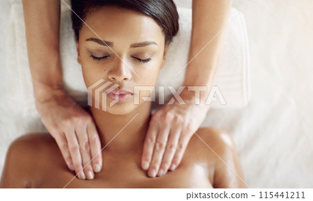 Woman, spa and massage for shoulder on bed, above and relax with physical therapy for muscle on vacation. Masseuse, girl and treatment for stress, fatigue and sleeping at wellness resort on holiday 115441211