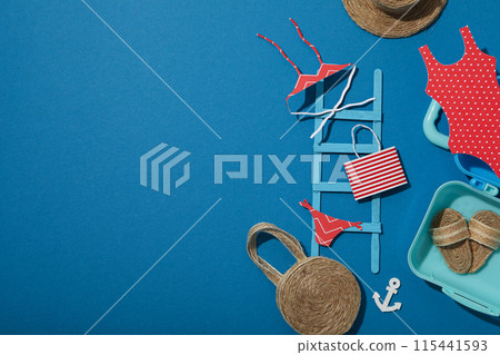 Miniature summer things for relaxing on the beach, near the sea. 115441593