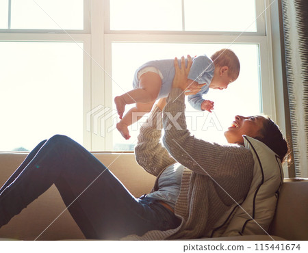 Happy, mother and baby on sofa playing on weekend for love, bonding and relationship development in home. Care, woman and child together on couch in summer for safety, support or relax in living room Happy, mother and baby on sofa playing on weekend for love, bonding and relationship development in home. Care, woman and child together on couch in summer for safety, support or relax in living room 115441674