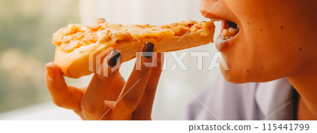Cropped image of woman holding pizza slice at restaurant Cropped image of woman holding pizza slice at restaurant 115441799