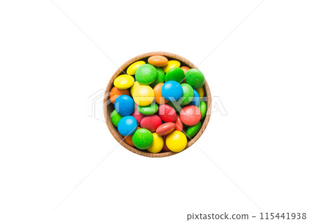 Multicolored candies in a bowl on a colored background. birthday and holiday concept. Top view with copy space 115441938