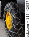 Snowplow tires with metal tire chains wrapped around them. They are essential in winter to prevent slipping. 115442057