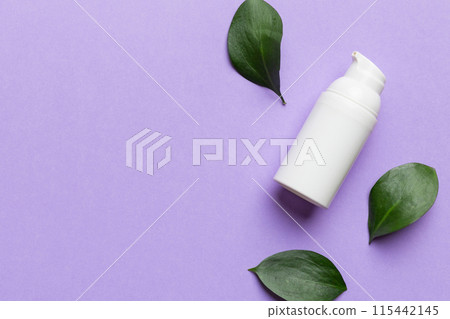 Organic cosmetic product with green leaves on color background. Copy space, flat lay Organic cosmetic product with green leaves on color background. Copy space, flat lay 115442145