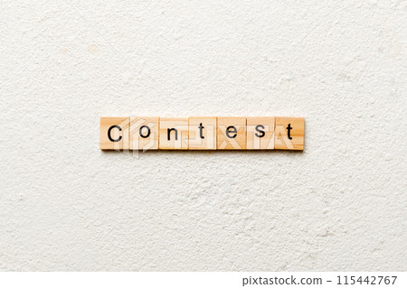 Contest word written on wood block. Contest text on cement table for your desing, Top view concept Contest word written on wood block. Contest text on cement table for your desing, Top view concept 115442767