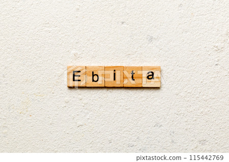 EBITA word written on wood block. EBITA text on cement table for your desing, concept EBITA word written on wood block. EBITA text on cement table for your desing, concept 115442769